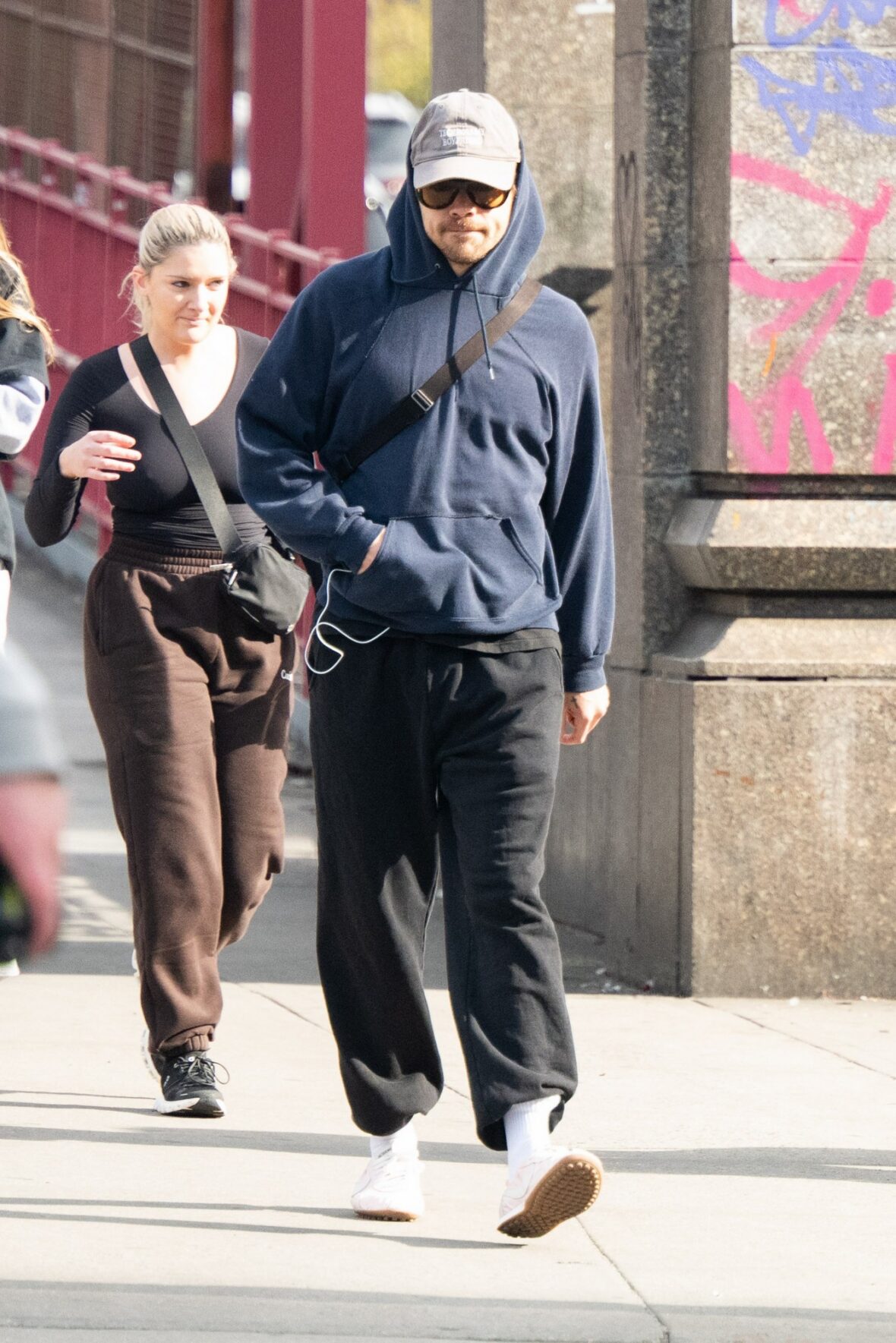 Harry Styles gets followed by an autograph seeker on the streets of New York City