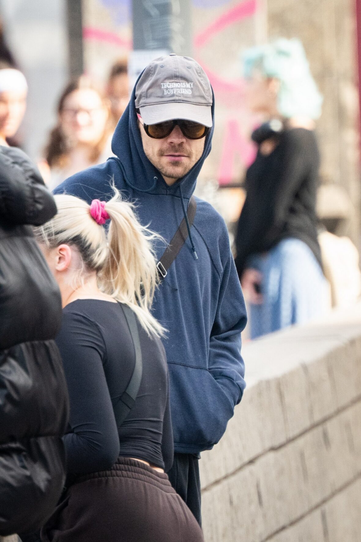 Harry Styles gets followed by an autograph seeker on the streets of New York City