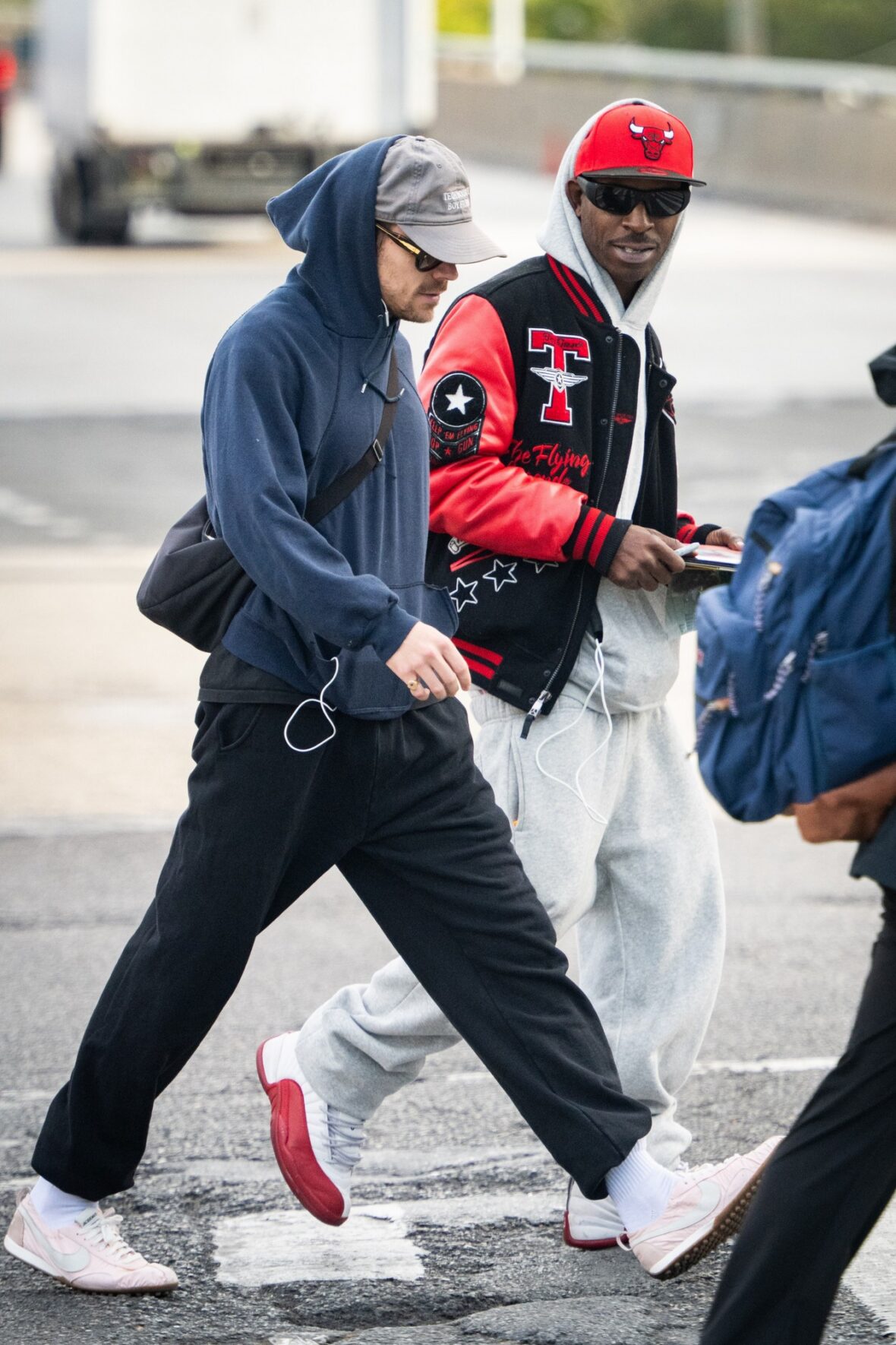Harry Styles gets followed by an autograph seeker on the streets of New York City