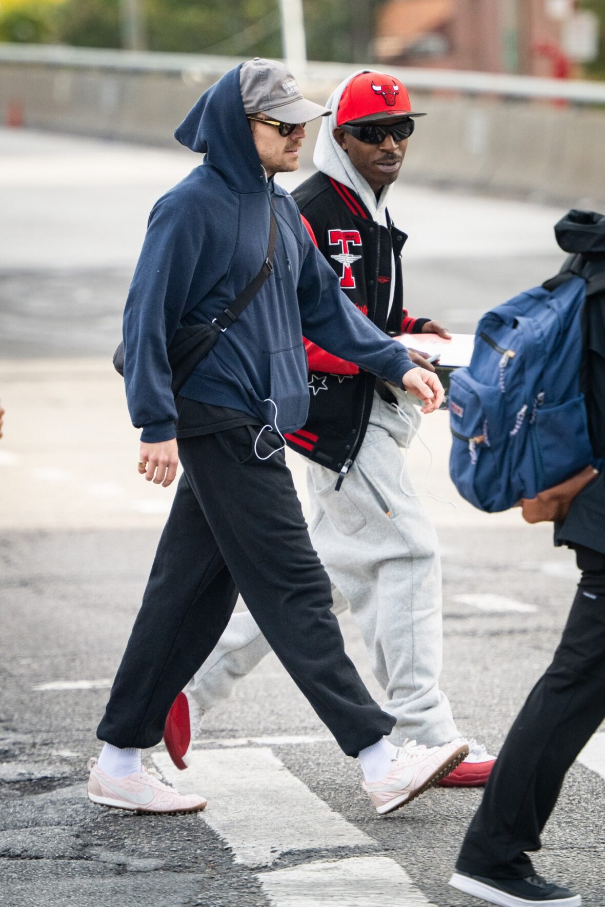 Harry Styles gets followed by an autograph seeker on the streets of New York City