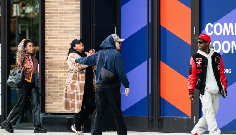 Harry Styles gets followed by an autograph seeker on the streets of New York City