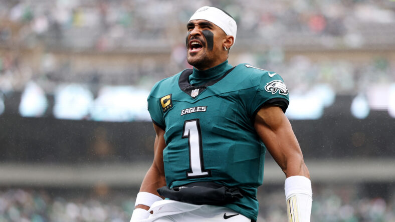Jalen Hurts in game with the Eagles, celebrating with his helmet off