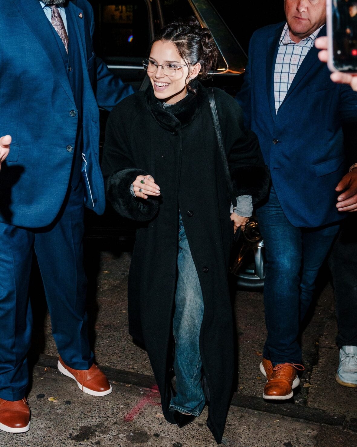 Inde Navarrette attends an SNL cast dinner in NYC wearing a long black coat