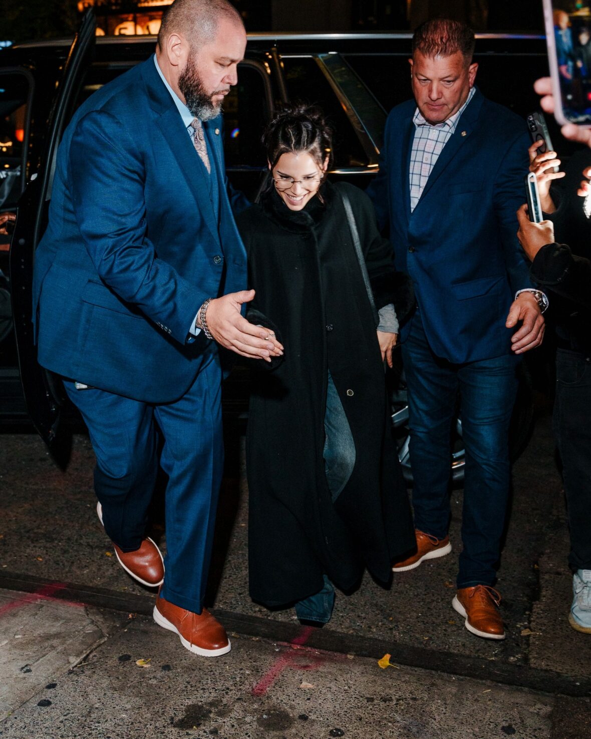 Inde Navarrette attends an SNL cast dinner in NYC wearing a long black coat