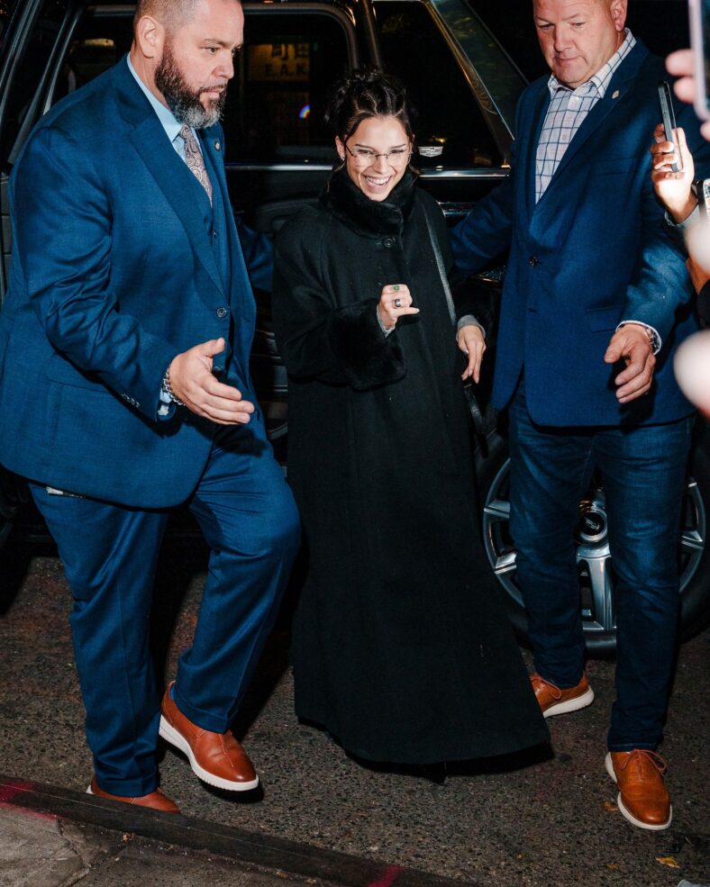 Inde Navarrette attends an SNL cast dinner in NYC wearing a long black coat