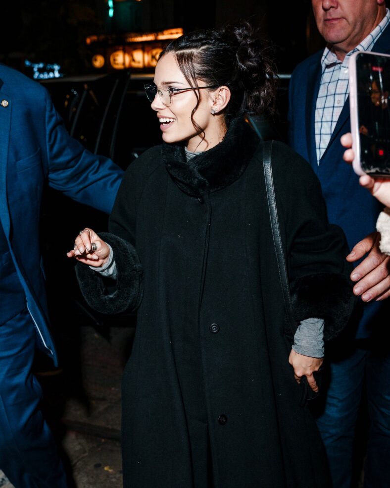 Inde Navarrette attends an SNL cast dinner in NYC wearing a long black coat
