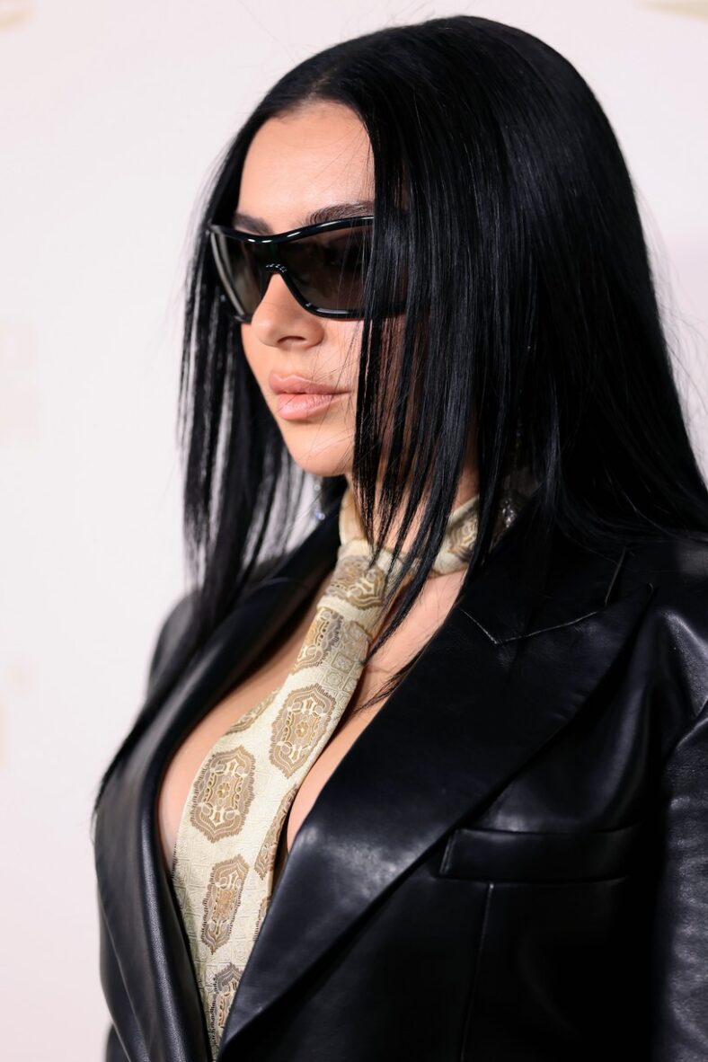 Charli XCX in custom black Balmain look at 2026 InStyle Imagemakers awards.
