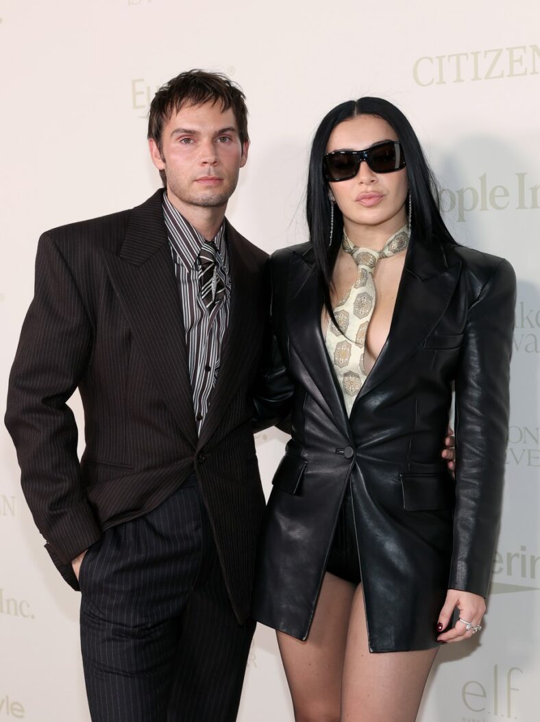 Charli XCX in custom black Balmain look at 2026 InStyle Imagemakers awards with Chris Horan.