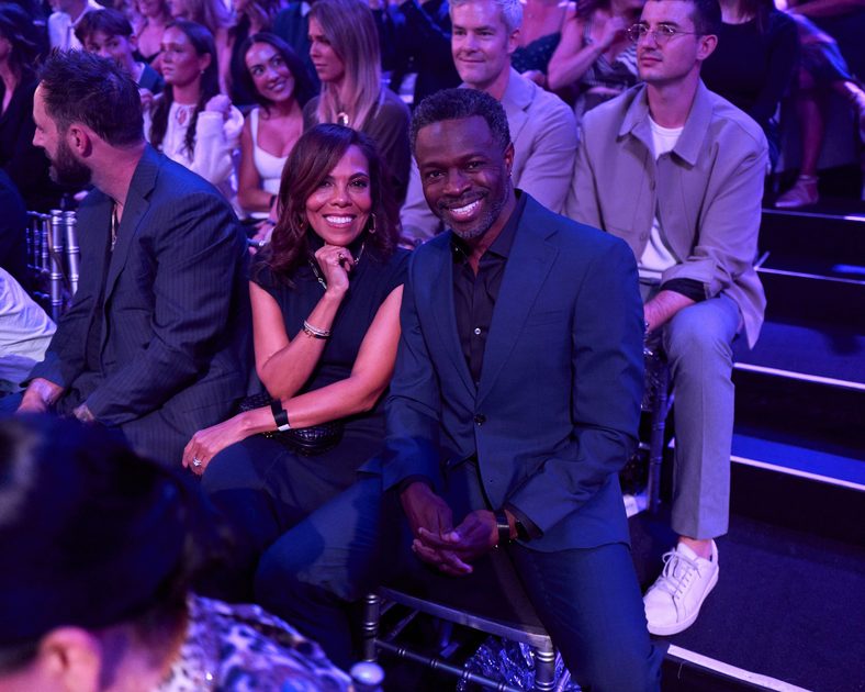Sean Patrick Thomas and wife Aonika Laurent pose for a photo in the audience at DWTS' Super Bowl Night