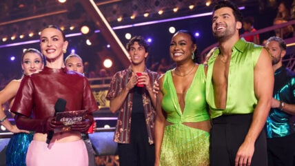 Jan RAvnik and Tatyana Ali getting their DWTS scores while standing next to Julianne Hough