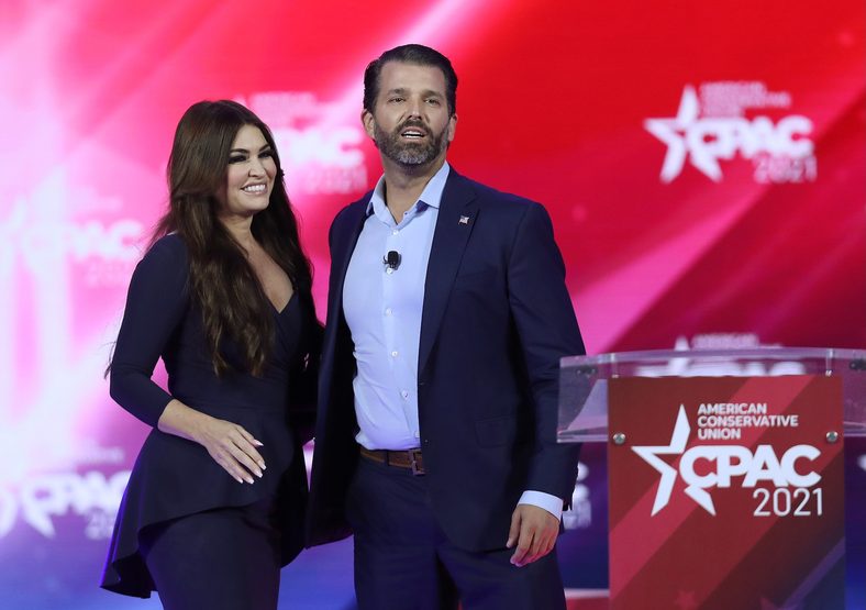 Don Trump, Jr. and Kimberly Guilfoyle stand on stage as they address the Conservative Political Action Conference being held in the Hyatt Regency on February 26, 2021 in Orlando, Florida. 