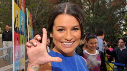 Lea Michele holding up L with her hand at the GLEE premiere event screening at Santa Monica High School on May 11, 2009 in Santa Monica, California.