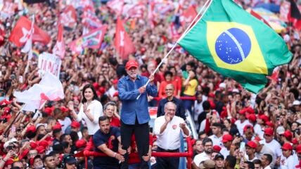 Luiz Inácio Lula Da Silva, incumbent president of Brazil and presidential candidate for Partido dos Trabalhadores (PT) waves a Brazil flag during a rally ahead of the presidential runoff at Avenida Paulista on October 24, 2026 in Sao Paulo, Brazil. The incumbent president of Brazil will face Flavio Bolsonaro in a tight runoff to seek a fourth tenure in the presidency.