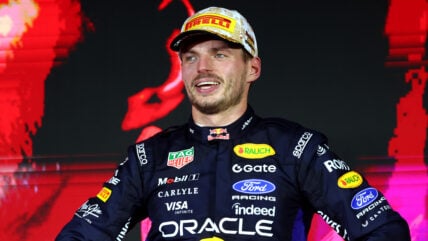 Max Verstappen poses on the podium at the Singapore Grand Prix