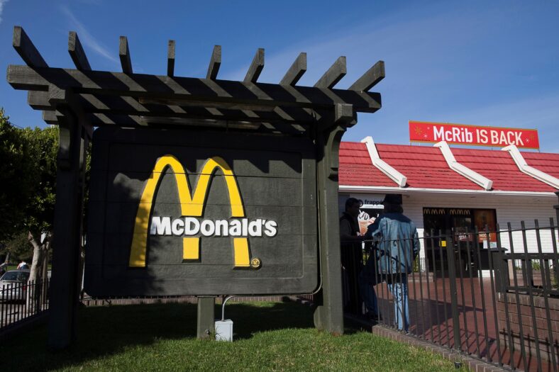 The outside of a McDonalds with a McRib is back sign
