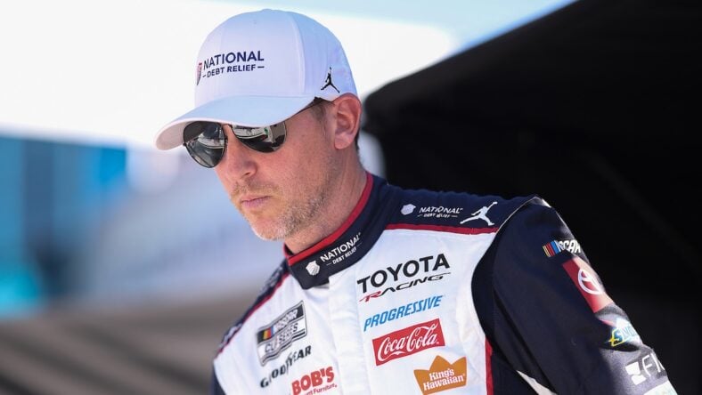Denny Hamlin October 2026 looking in hat and sunglasses