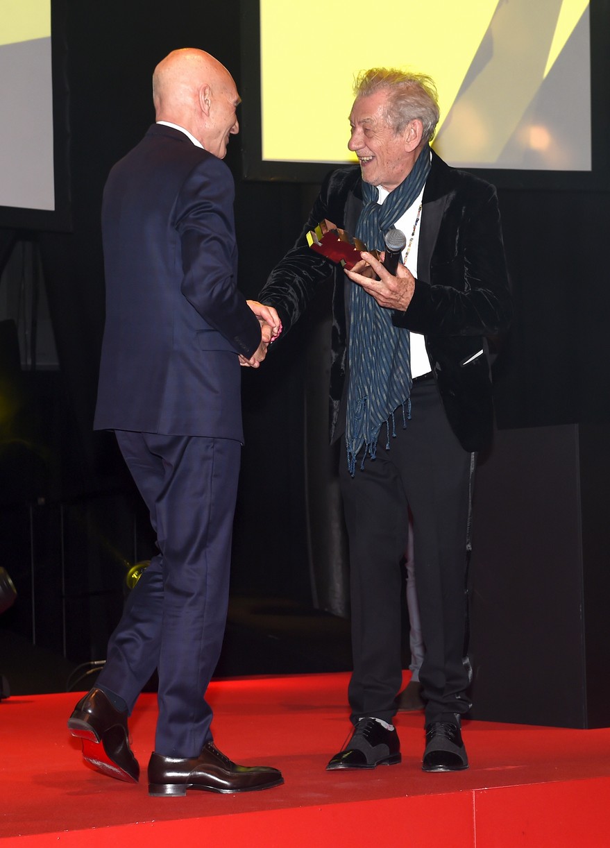 Patrick Stewart and Ian McKellen posing together for a photo.