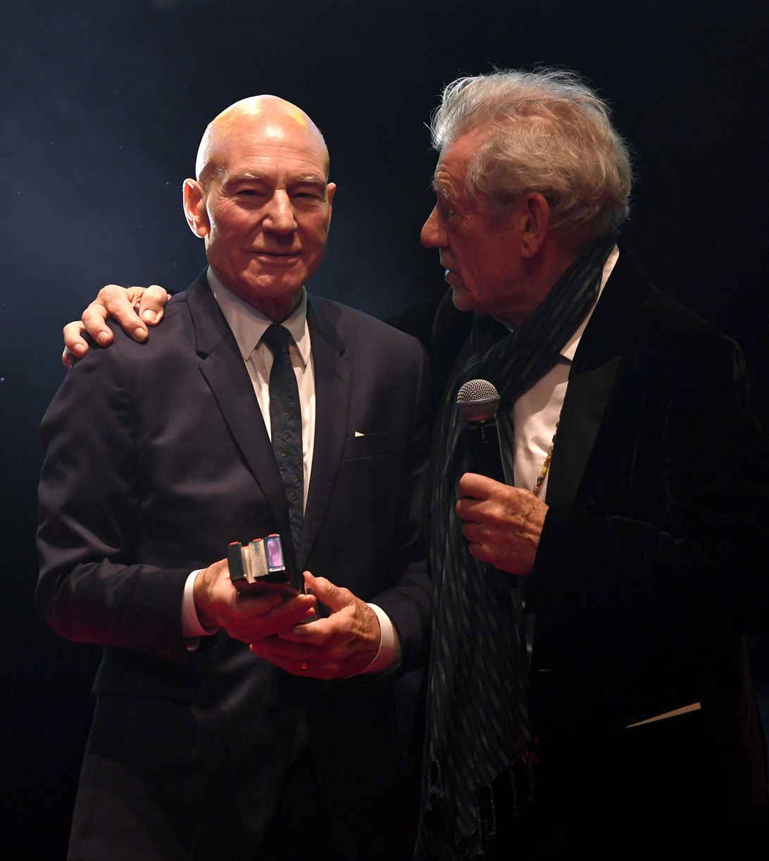 Patrick Stewart and Ian McKellen posing together for a photo.
