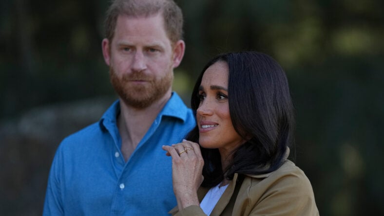 Prince Harry, Duke of Sussex and Meghan, Duchess of Sussex during a Scar Tree Walk.