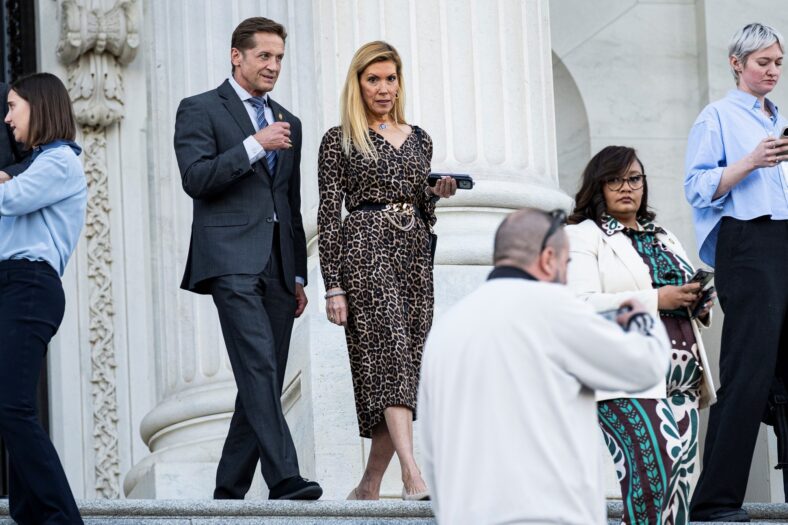 Congresspeople McCormick and Van Duyne leaving the congress building