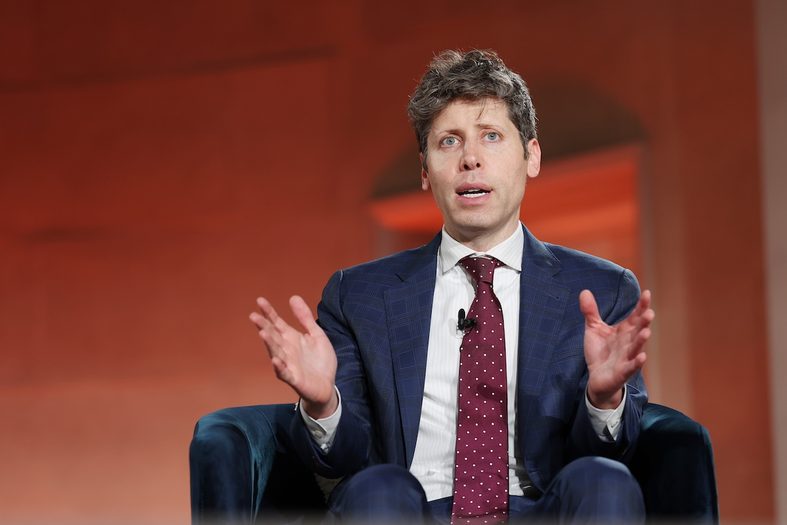 Sam Altman seated in chair