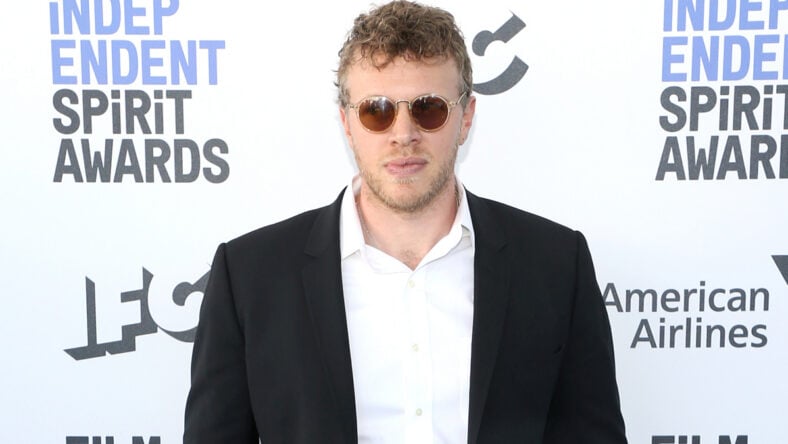 Sebastian Bear-McClard in a black suit jacket and sunglasses at IFC event.