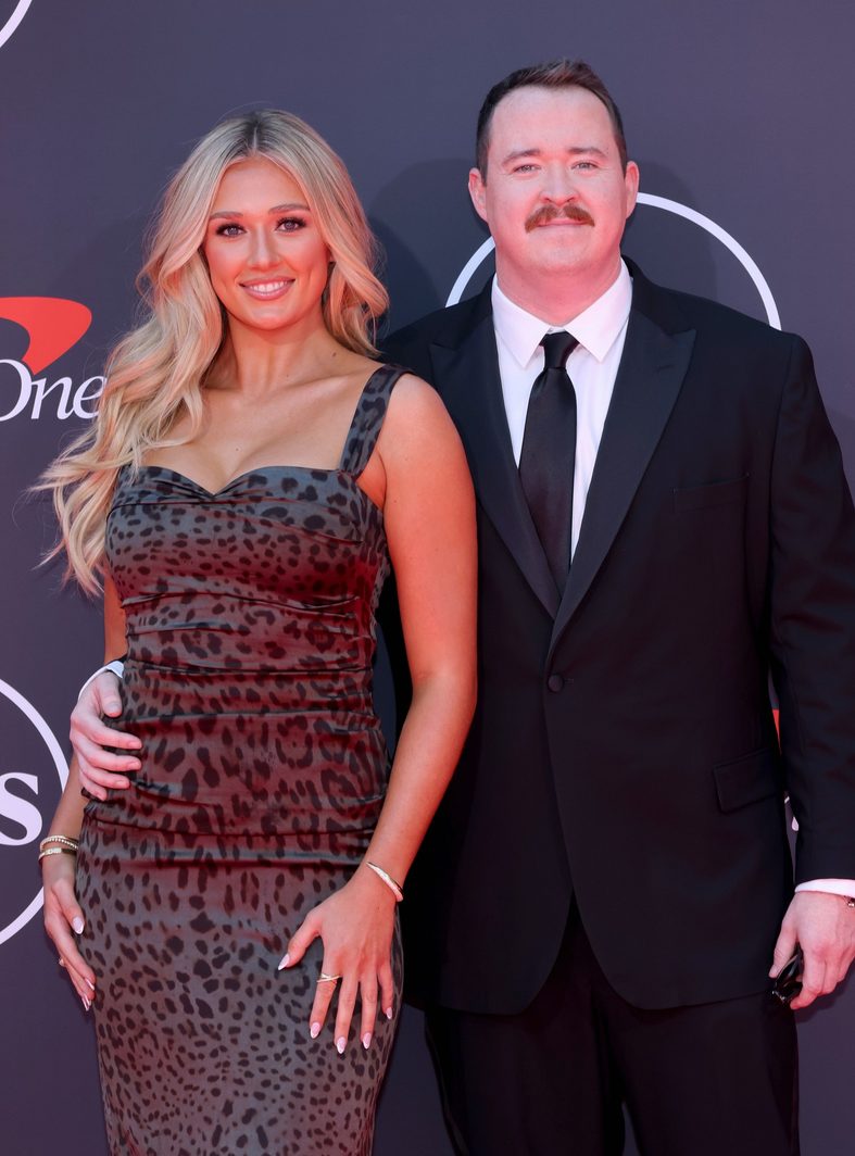 Shane Gillis and Grace Brassel pose on the red carpet at the 2025 ESPY Awards