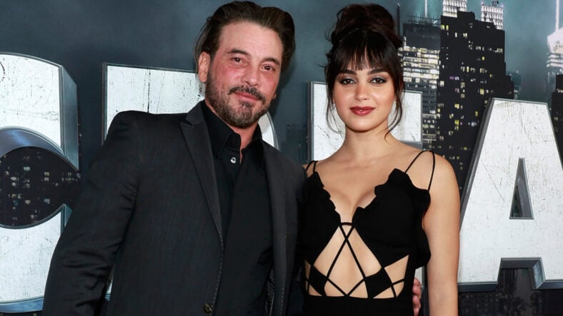 Skeet Ulrich and Melissa Barrera pose together for a photo on the red carpet for the Scream VI premiere.