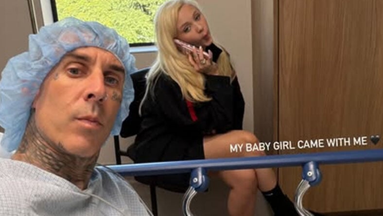Travis Barker taking a selfie from the hospital with his daughter Alabama in the background