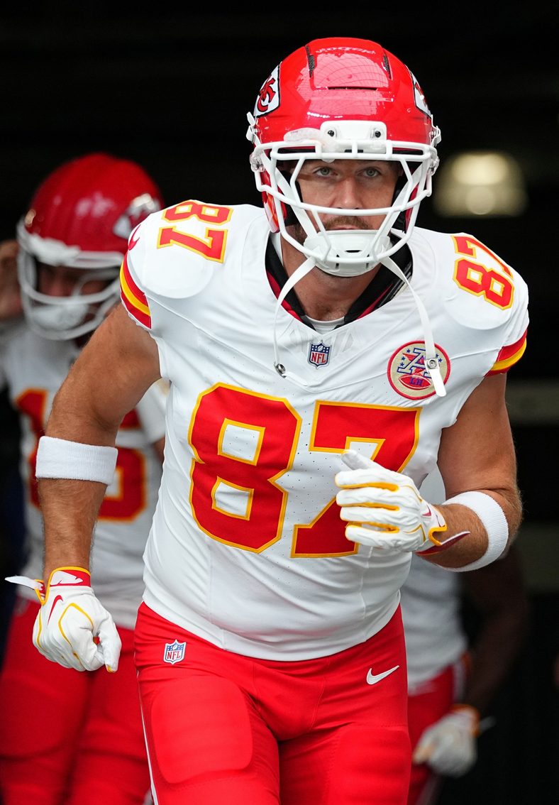 Travis Kelce enters the field ahead of a football game 